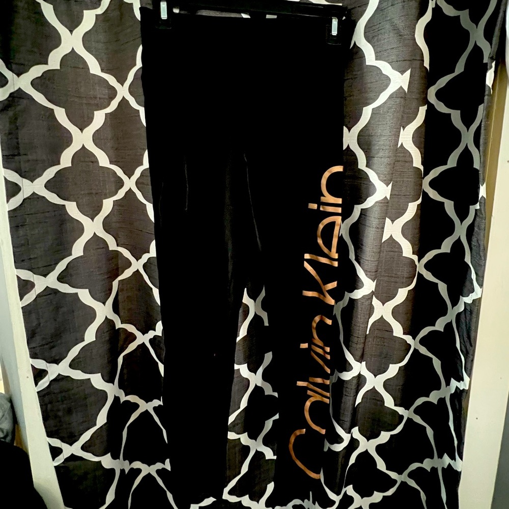 Black Calvin Klein leggings with gold lettering on side